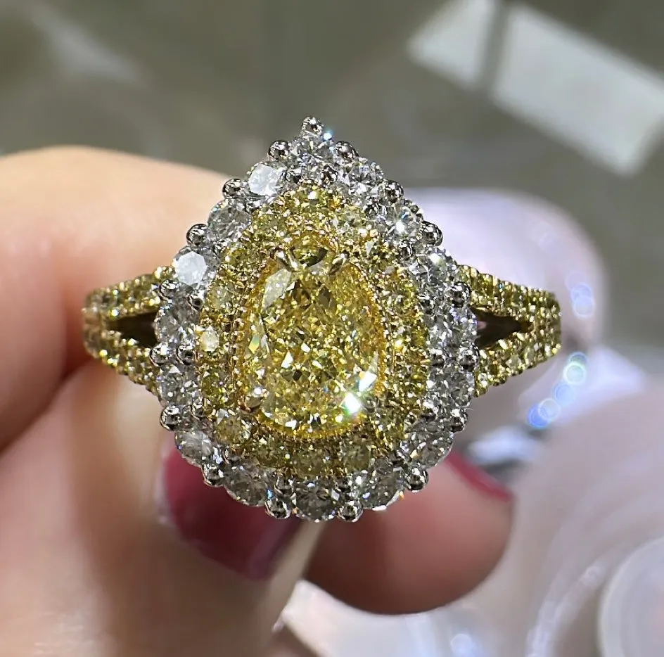 1.35ct tw Pear Shape Fancy Yellow Center with Halo Split Shank Diamond Ring