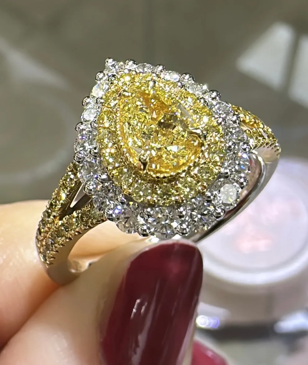 1.35ct tw Pear Shape Fancy Yellow Center with Halo Split Shank Diamond Ring
