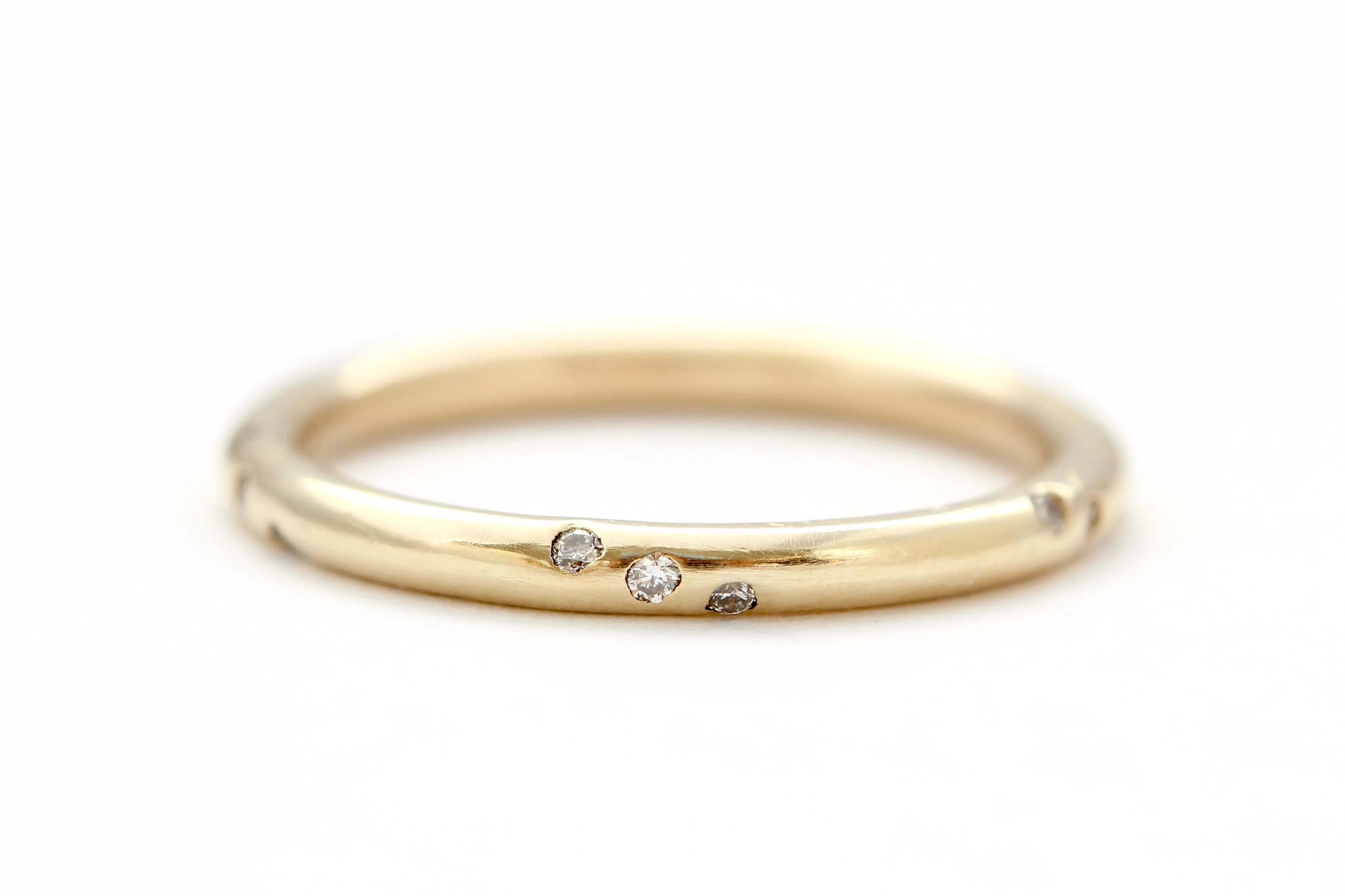 14k yellow gold ring with round white diamonds