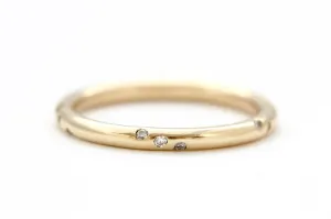 14k yellow gold ring with round white diamonds