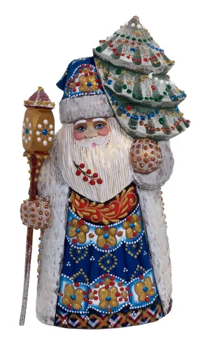 Luxurious dressed Santa with Christmas tree