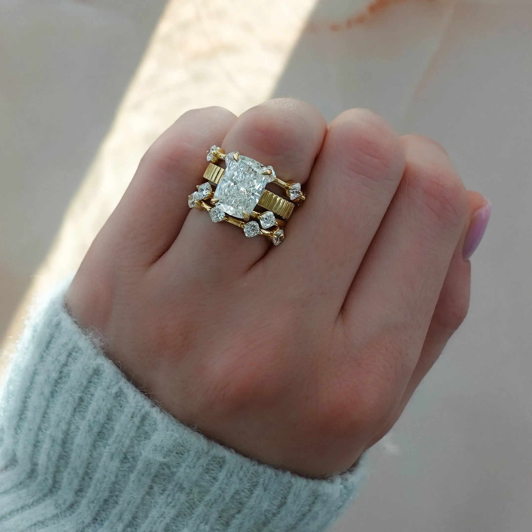 Spaced Compass Wedding Band with Four Cushion Cuts